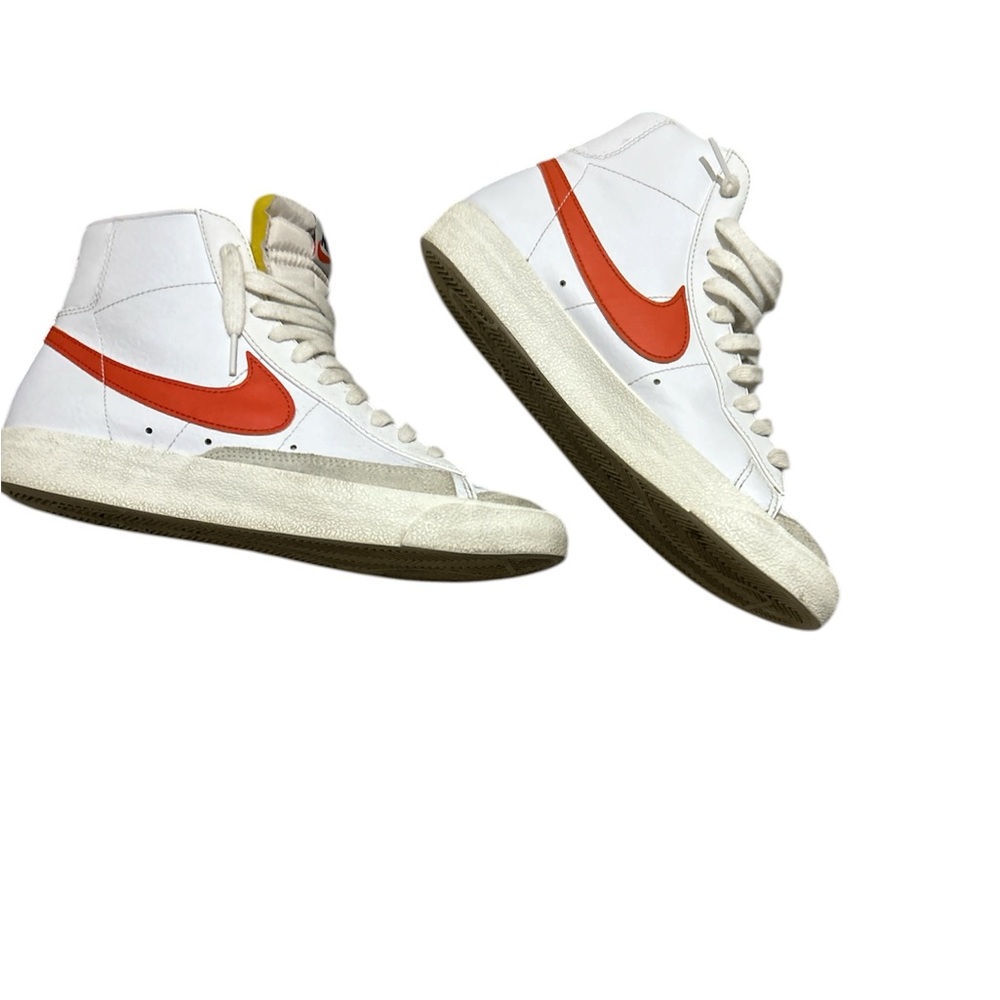 Nike White High-Top Sneakers with Orange Swoosh